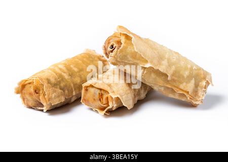 Crispy vegetables spring Rolls on Ceramic Plate isolated on white background Stock Photo