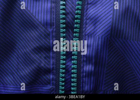 Close-up shot of the zipper teeth on a blue coat Stock Photo