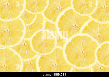 Lemon pattern. Yellow citrus slices background. Fresh and vibrant fruit design. Summer tropical concept. Organic healthy texture. Decorative and juicy Stock Photo