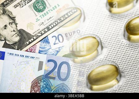 Finance and healthcare concept. Transparent capsules on money. Budget and medical expenses. Pills on euro and dollar. Economic cost of treatment. Stock Photo