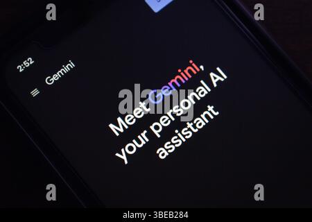 Mexico City, MEXICO - May 26 2025 : Close-up of a phone screen showing the Gemini personal AI assistant welcome page with dark mode interface. Stock Photo