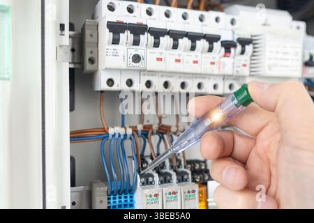Electrician Testing Electrical Panel Voltage Stock Photo