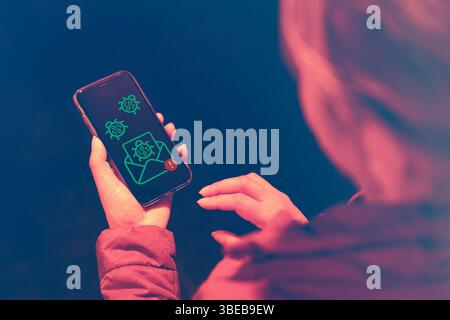 Woman received a malicious message containing a virus. An infected phone. Personal data theft. Careless practices in using electronic devices Stock Photo