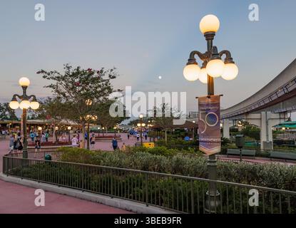 Moon in the sky in the early evening outside the entrance to the Magic Kingdom at Walt Disney World in Orlando, Florida, USA Stock Photo