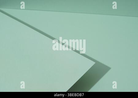The colorful background from green paper with shadow. Abstract geometric Stock Photo