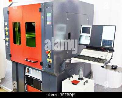 Laser cutting machine for precision with control panel laptop Stock Photo