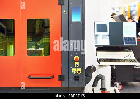 Laser cutting machine for precision with control panel laptop Stock Photo