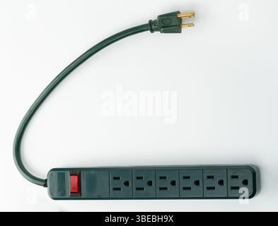 Power strip featuring several outlets and on/off switch, designed for convenient electrical connections at home or work. Stock Photo