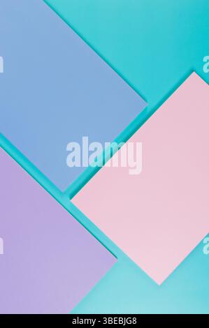 Top view of pink, purple and blue notebooks on blue background. School, office wallpaper. Flat lay, copy space. Stock Photo