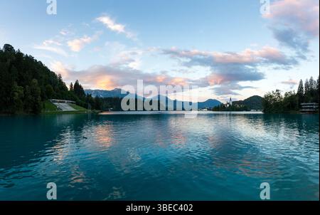Mystic and magic sunset above the Bled lake, Slovenia. Beautiful magic purple colors and peaceful lake with church on the island. Magic sunset above t Stock Photo