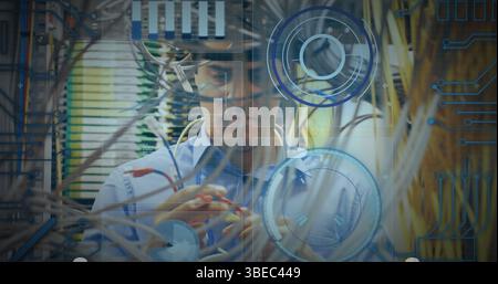 Round scanners and microprocessor connections against caucasian male engineer working Stock Photo