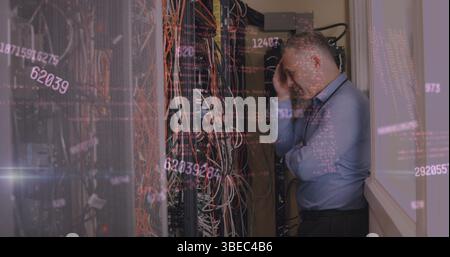 Inspecting IT pro fixing Ethernet cables in network closet, server rack, digital codes, copy space Stock Photo