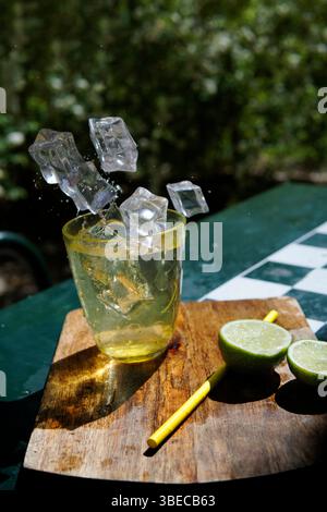 ice cubes falling into glass Stock Photo