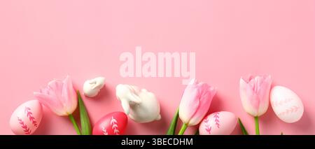 Happy Easter banner design with tulips, Easter eggs, decorative bunnies on pink background. Stock Photo