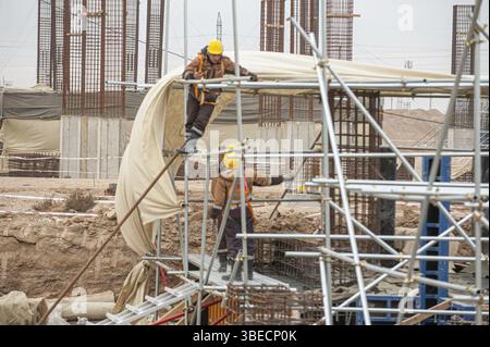 A workers with special equipment in a construction site make formwork Stock Photo