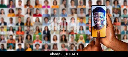 A hand holds a smartphone displaying a face scan of a smiling individual Stock Photo