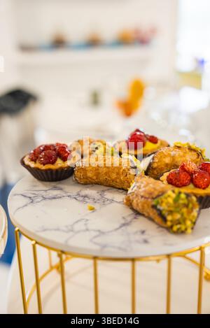 Italian Pastries with Cannoli and Tartlets on Marble Platter in Amalfi Stock Photo