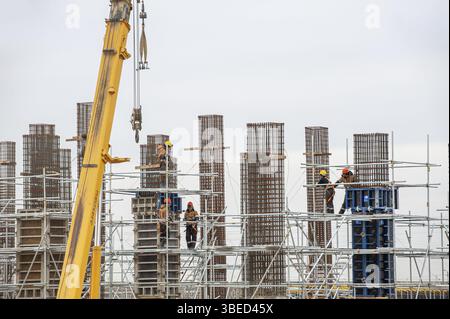 A workers with special equipment in a construction site make formwork Stock Photo