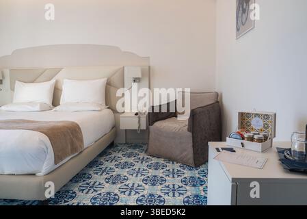 Modern Hotel Room with Blue and White Patterned Tile Floor in Amalfi Stock Photo