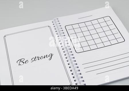 Open notepad with markup on a white background Stock Photo