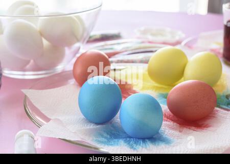 Painting in different colors of eggs for Easter Stock Photo