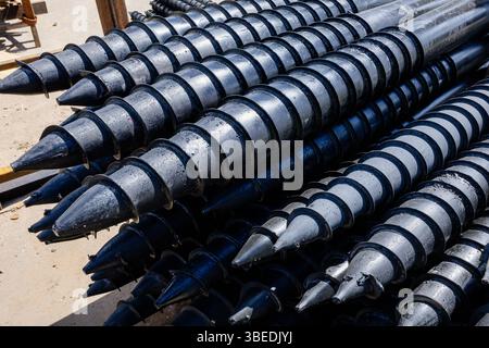 Stack of screw piles for house foundation Stock Photo - Alamy
