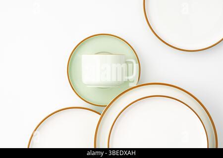 A set of ceramic tableware isolated on white background Stock Photo