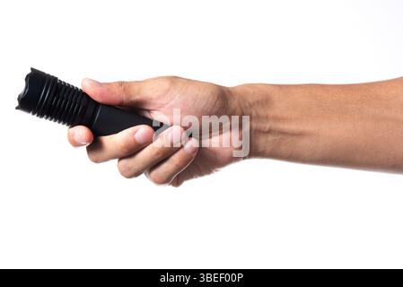The man holding a LED flashlight in hand. Stock Photo