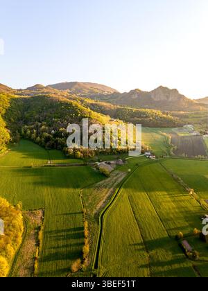 Aerial view of the lush green hills and dense tropical forest landscape ...