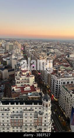Aerial view of Gran Via and rooftops of central Madrid, Spain, taken during sunset Stock Photo