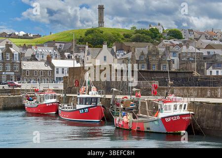 Macduff Aberdeenshire Scotland three small fishing boats moored or berthed in the harbour Stock Photo