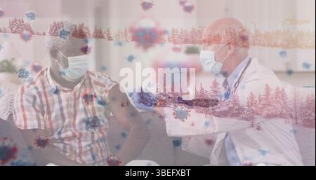 Image of virus cells over caucasian male doctor with patient Stock Photo