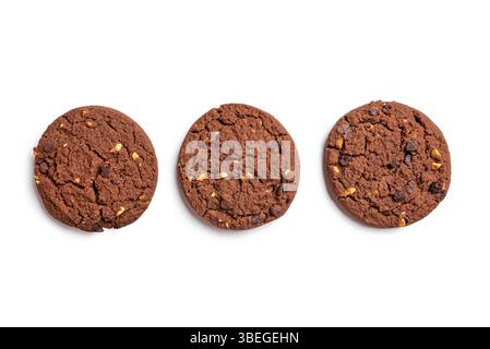 Chocolate chip cookies with hazelnuts isolated on white background, top view, design elements. Three homemade chocolate brownie cookie. Stock Photo