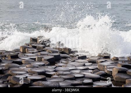 Waves breaking over the Giant's Causeway, Co. Antrim, Ireland Stock Photo
