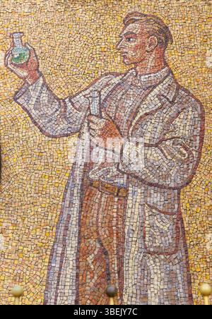 Mosaic figure chemist holding a flask and measuring cylinder part of clock showing time and astronomical data on the town hall, Olomouc, Moravia, Czec Stock Photo