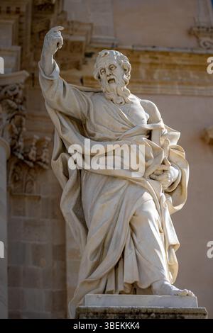 Sculpture of a single saint in front of a church, Sicily, Italy, with no people Stock Photo