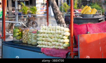 Fresh Ripe Corn Cobs At A Market Stall, Street Food In India, Healthy Eating, Steamed And Grilled Vegetable For Sale Stock Photo