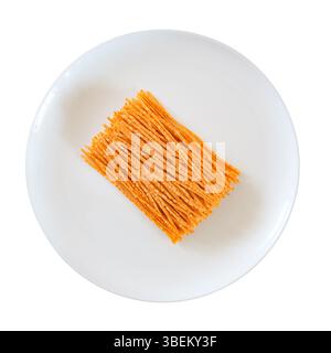 dried fish straws on plate, top view, isolated on white background with clipping path Stock Photo