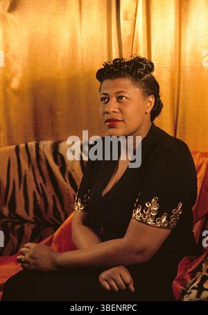 Kodachrome photo of Ella Fitzgerald taken by Carl Van Vechten. Ella Jane Fitzgerald (April 25, 1917 – June 15, 1996) was an American singer, songwriter and composer, sometimes referred to as the "First Lady of Song", "Queen of Jazz", and "Lady Ella". She was noted for her purity of tone, impeccable diction, phrasing, timing, intonation, absolute pitch, and a "horn-like" improvisational ability. Stock Photo