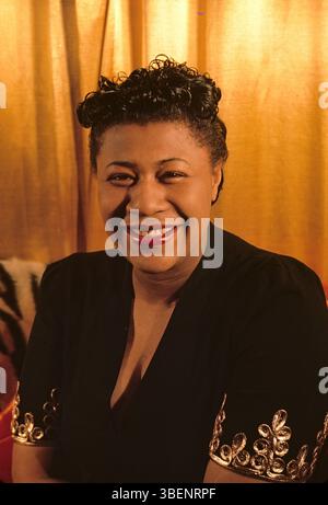 Kodachrome photo of Ella Fitzgerald taken by Carl Van Vechten. Ella Jane Fitzgerald (April 25, 1917 – June 15, 1996) was an American singer, songwriter and composer, sometimes referred to as the "First Lady of Song", "Queen of Jazz", and "Lady Ella". She was noted for her purity of tone, impeccable diction, phrasing, timing, intonation, absolute pitch, and a "horn-like" improvisational ability. Stock Photo