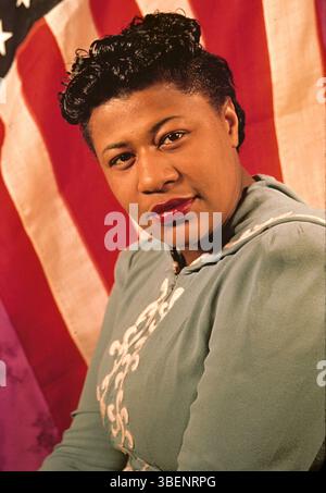 Kodachrome photo of Ella Fitzgerald taken by Carl Van Vechten. Ella Jane Fitzgerald (April 25, 1917 – June 15, 1996) was an American singer, songwriter and composer, sometimes referred to as the "First Lady of Song", "Queen of Jazz", and "Lady Ella". She was noted for her purity of tone, impeccable diction, phrasing, timing, intonation, absolute pitch, and a "horn-like" improvisational ability. Stock Photo