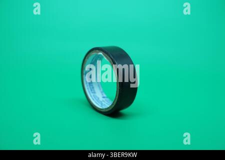 Black tape is commonly used to insulate electrical wires to make it safer. Stock Photo