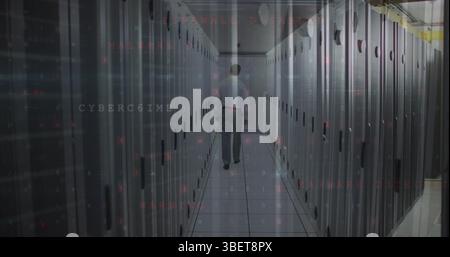 Image of cyber security data processing against male engineer walking in server room Stock Photo