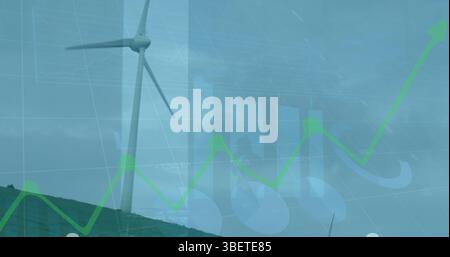 Image of financial data and graphs over landscape with wind turbines Stock Photo