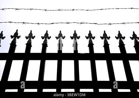 fence and barbed wire on white background Stock Photo