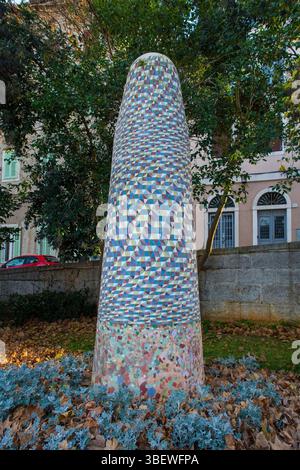 Pula, Croatia – Dec 25th 2024. A contemporary public art piece in central Pula in Istria, Croatia. A mosaic covered tall tapered cylindrical column Stock Photo