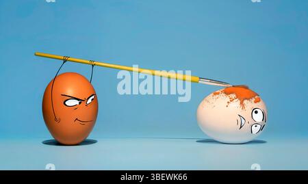 Two chicken eggs on a blue background, brown paints white with a brush, with a sly and frightened look on the faces Stock Photo