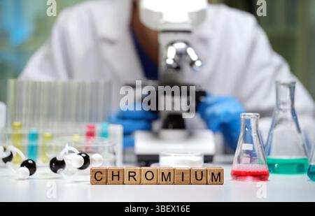 Conducting Laboratory Research on Chromium Using a Microscope and Various Glassware Equipment Stock Photo