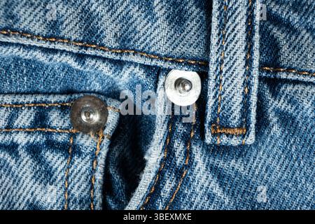Macro Texture Blue Natural Denim. Metal Denim Tack Button. Stock Photo