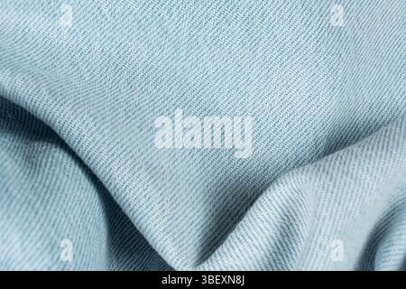 Wavy Pattern of Blue Jean Fabric. Close-Up Textured. Stock Photo